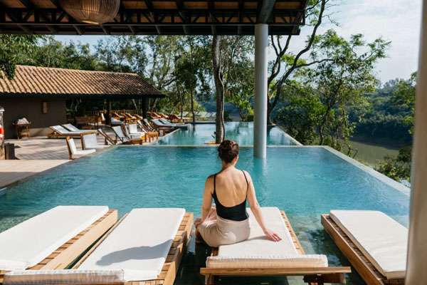 Relaxing by the poolside at Hotel Loi suites